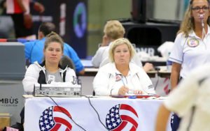 Two women sitting at scoring table