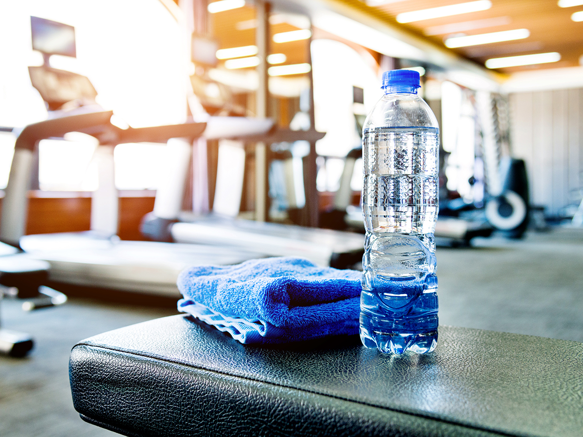 Towel and a bottle of water in gym