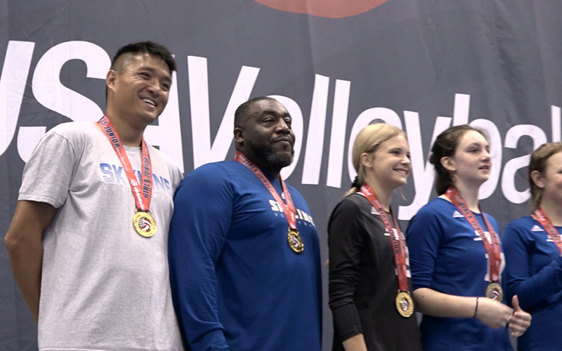 Coaches on medal stand