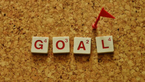 The word GOAL in scrabble letters