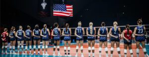 U.s. women lined up for national anthem with flag