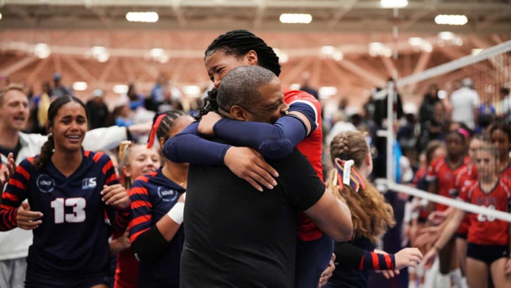 A Drive Nation player hugs her father
