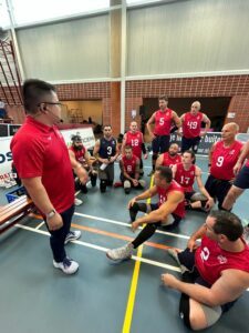 Greg Walker talks to the men's sitting team