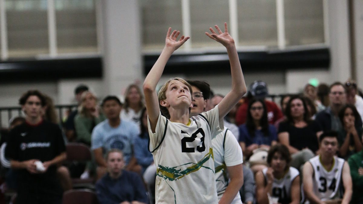 Boys volleyball player sets the ball