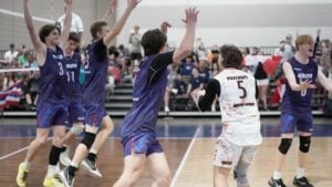 Boys celebrate on the court