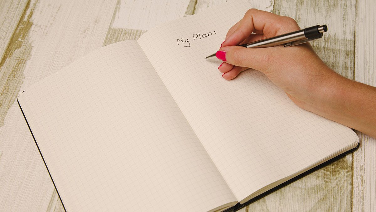 A notebook with the words "My Plan" on it