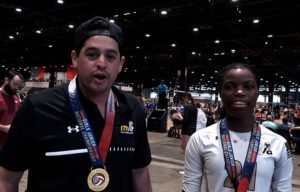 A male coach and female player talking