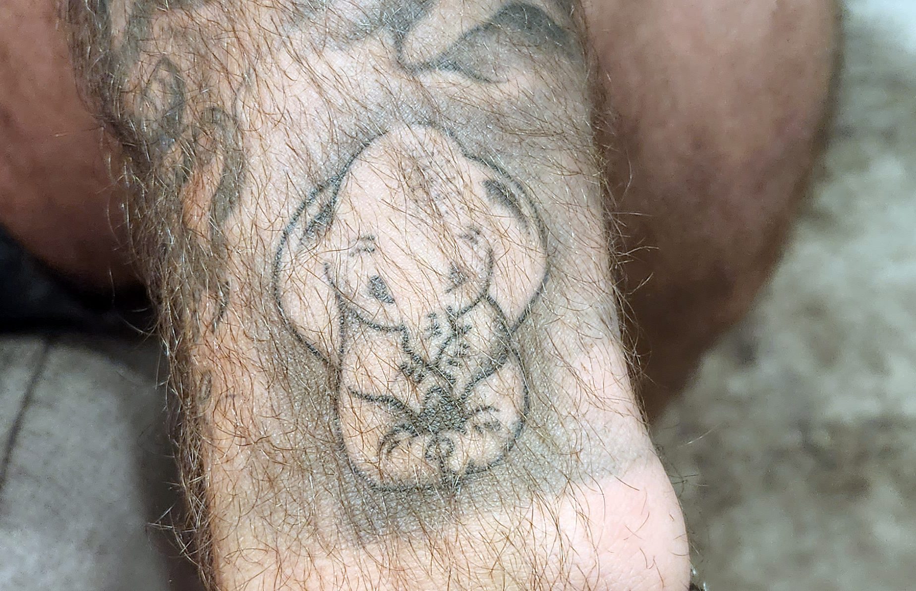 Photo of tattoo of baby Dumbo the elephant