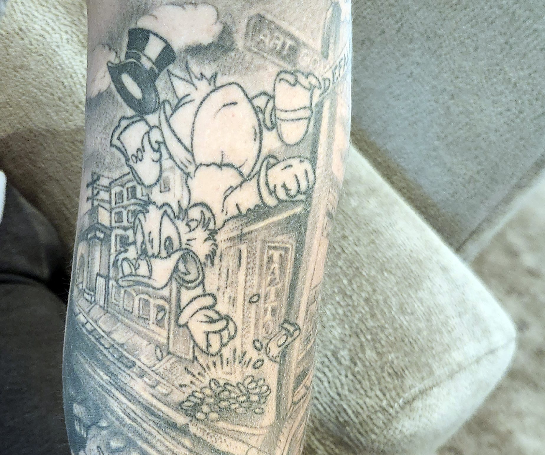 Photo of tattoo of Scrooge McDuck