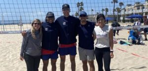 Tate Calles and Brendan Onishchenko pose with USA NTDP staff