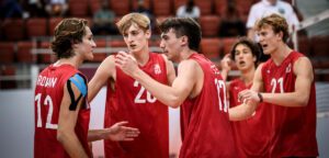 Trent Moser, Zach Rama, Andrew Rowan, Alex Rottman, and Wesley Smith huddle at the U21 World Championship