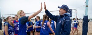 Beach NTDP coach high fives an athlete