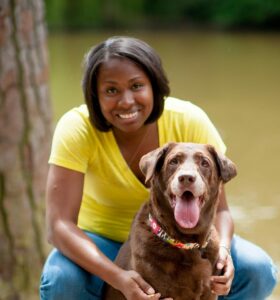 A photo of Alisha Boyd and a dog.