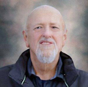 A headshot of John Patterson