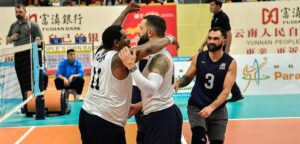Roderick Green, James Stuck, and Nick Dadgostar celebrate the U.S. victory over Iraq in the 2024 World ParaVolley Sitting Volleyball Final Qualifier.