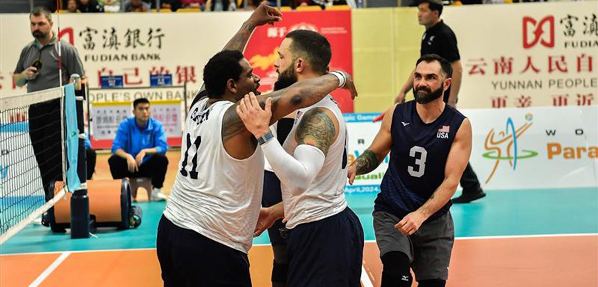 Roderick Green, James Stuck, and Nick Dadgostar celebrate the U.S. victory over Iraq in the 2024 World ParaVolley Sitting Volleyball Final Qualifier.