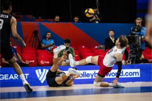 Photo of U.S. Men's National Team libero Kyle Dagostino sliding kick save against Poland at 2024 Volleyball Nations League
