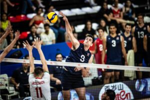 Photo of U.S. Opposite Jake Hanes attacking against Bulgaria at the 2024 Volleyball Nations League.