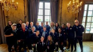 The women's sitting team poses before opening ceremonies at 2024 Super Six