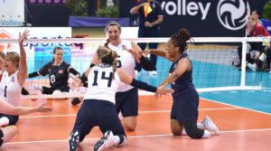 Kaleo Kanahele Maclay, Katie Bridge, Sydney Satchell celebrate on the court