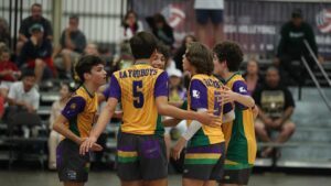 Boys celebrate on the court