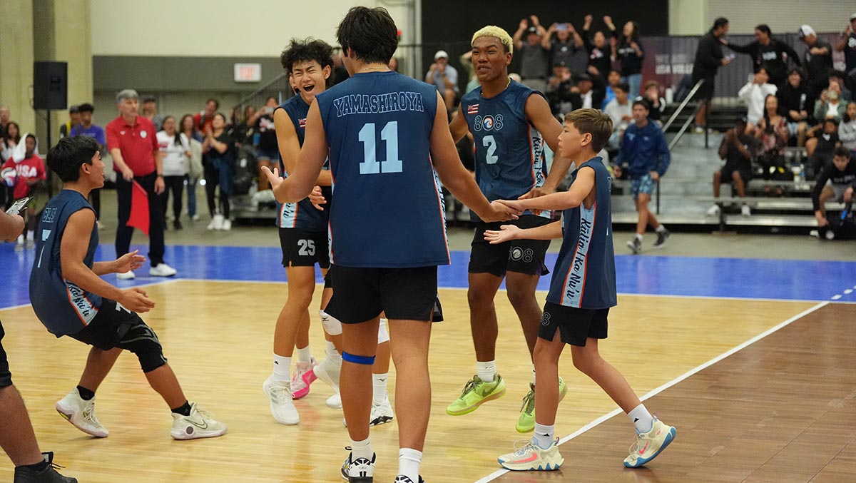 Boys celebrate on the court
