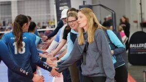 parents and kids shake hands after a game
