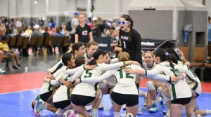 A team huddles around one player pregame at GJNC 14-17