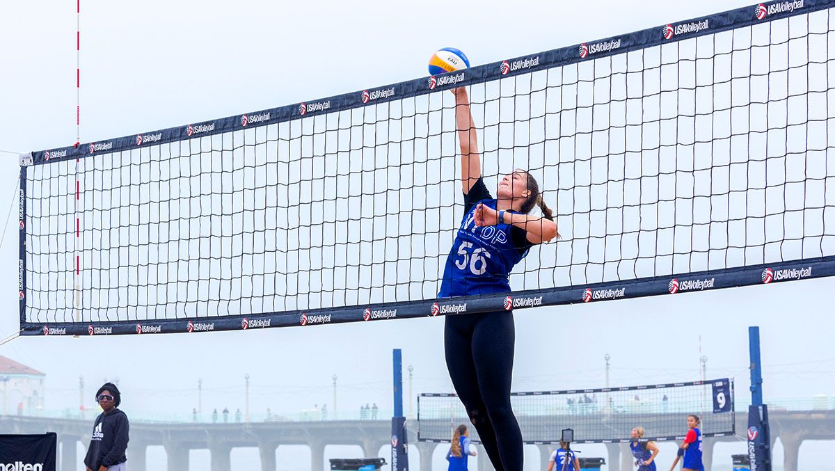A girls beach ntdp player goes up for an attack