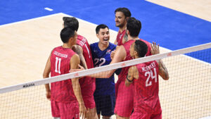 The men's national team huddles on the court