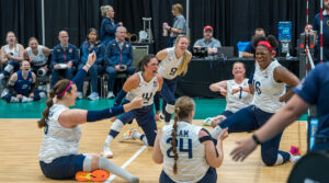 The U.s. women's sitting team celebrates