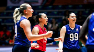 Jess Mruzik, Elena Ogilvie and Caitie Baird celebrate a point against Cuba.