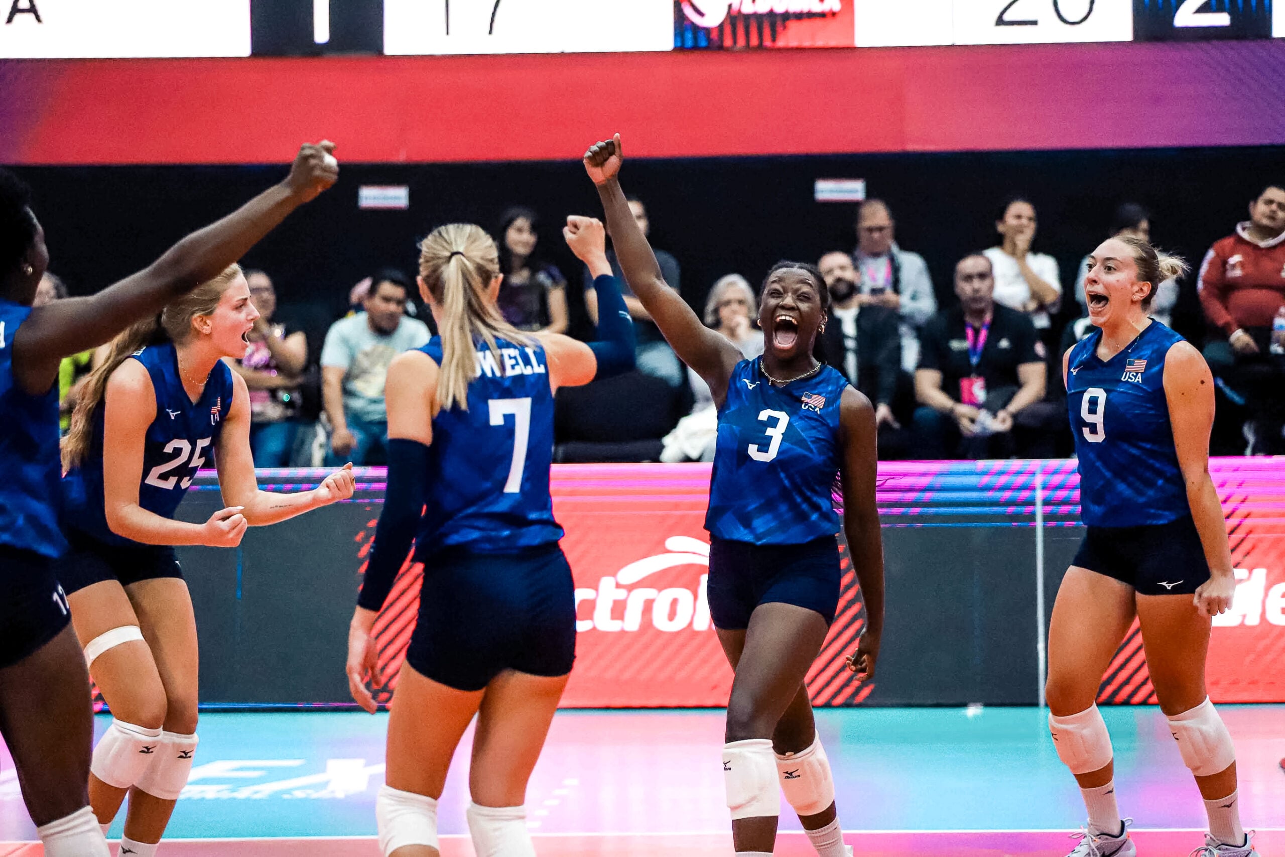 Toyosi Onabanjo raises her fist to celebrate a USA point