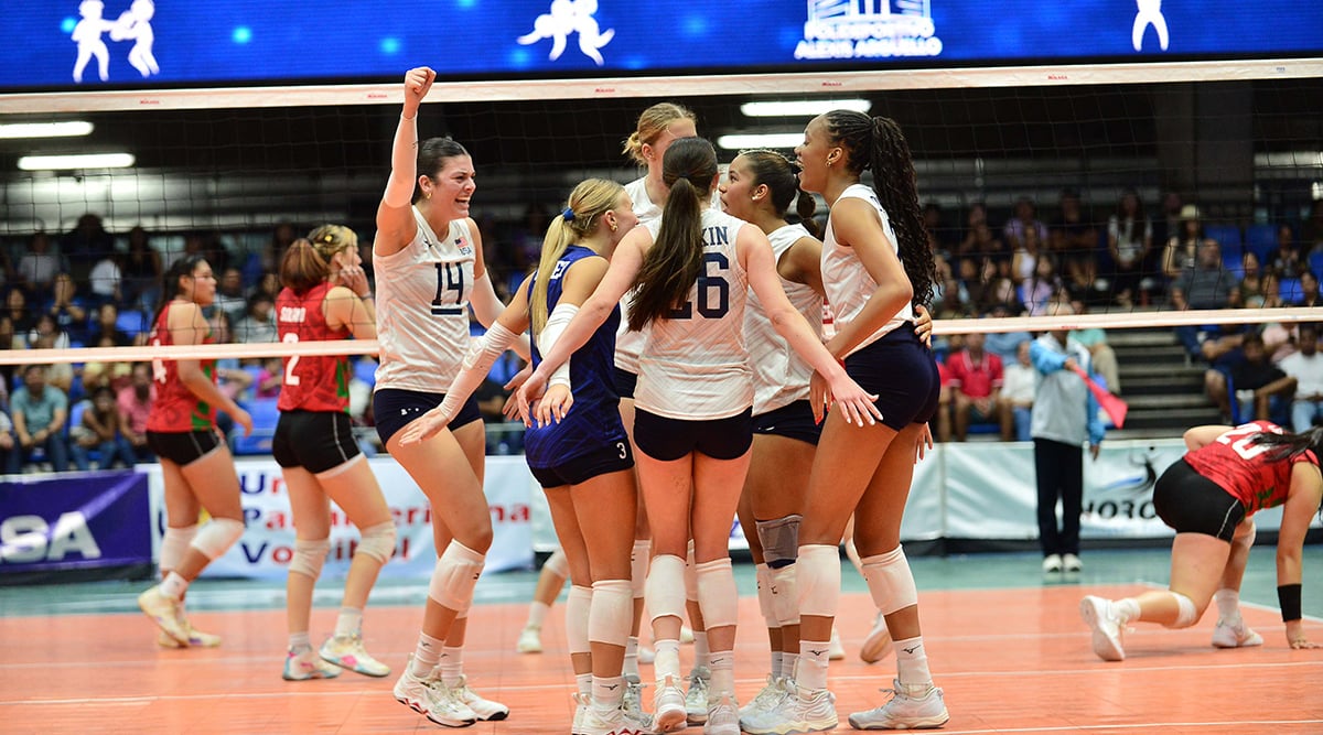 The Women's U23 National TEam huddles on the court to celebrate